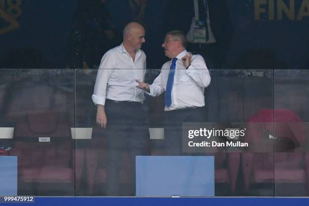 President Gianni Infantino talks with International Olympic Committee president Thomas Bach as they attend the 2018 FIFA World Cup Final between...