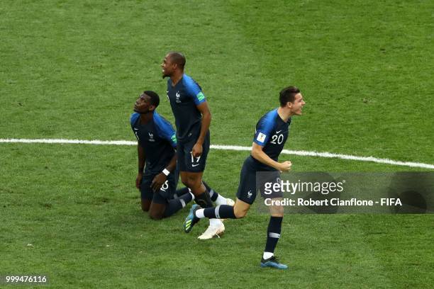 Paul Pogba, Djibril Sidibe and Florian Thauvin of France celebrate their team's victory following the 2018 FIFA World Cup Final between France and...