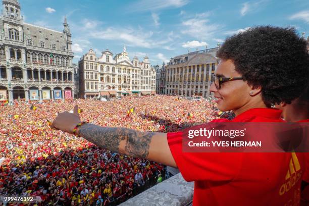 Belgium's Axel Witsel celebrates at the balcony in front of more than 8000 supporters at the Grand-Place, Grote Markt in Brussels city center, as...