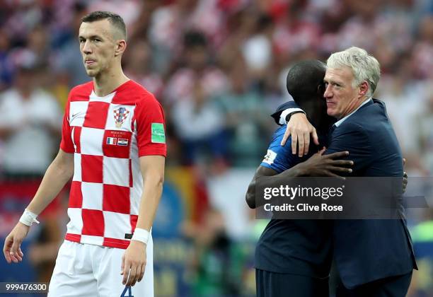 Didier Deschamps, Manager of France and Ngolo Kante of France celebrate following their sides victory in the 2018 FIFA World Cup Final between France...