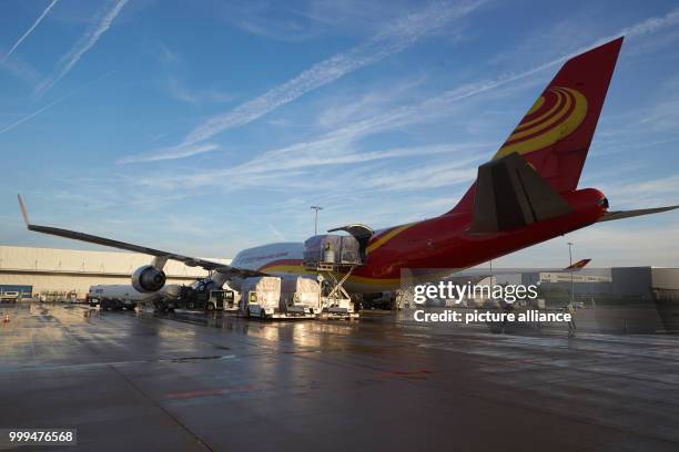 An aircraft of the type Boeing 747-400 of the Chinese cargo airline Suparna is unloaded after its first flight at the Hahn airport in Hahn, Germany,...