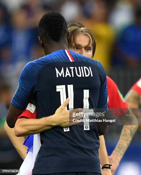 Blaise Matuidi of France embraces Luka Modric of Croatia following the 2018 FIFA World Cup Final between France and Croatia at Luzhniki Stadium on...