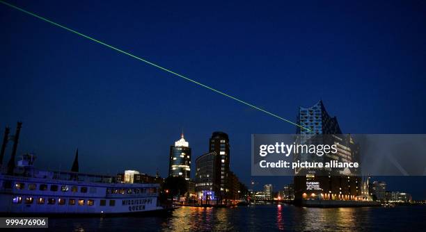 Laser beam can be seen from the Elbe Philharmonic Hall in Hamburg, Germany, 28 August 2017. On 01 September 2017, the world's brightest X-ray laser...