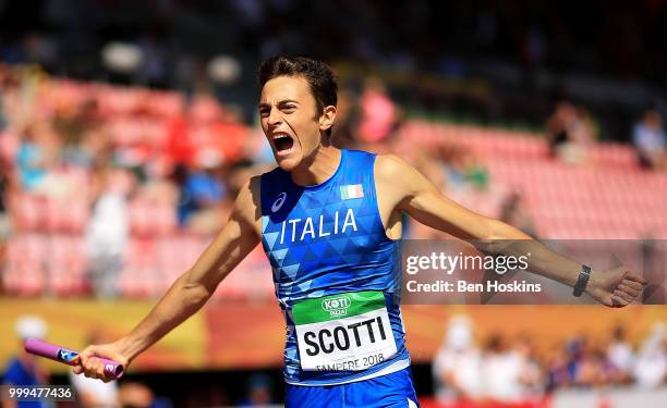 Edoardo Scotti of Italy crosses the finish line to win Italy gold in the final of the men's 4x400m relay on day six of The IAAF World U20...