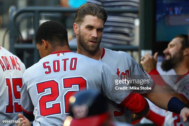 Bryce Harper and Juan Soto of the Washington Nationals hug prior to the start of the game against the New York Mets at Citi Field on July 13, 2018 in...