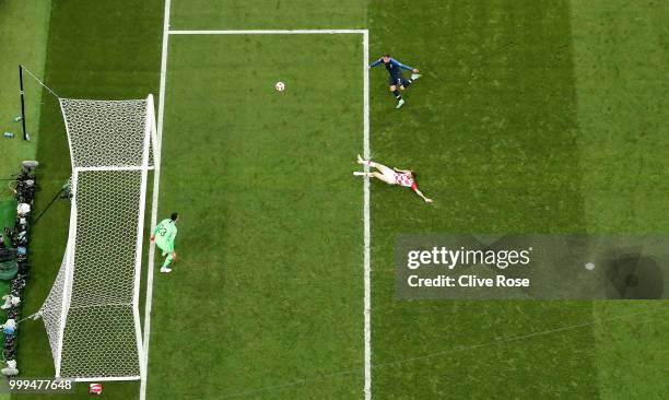 Antoine Griezmann of France gets in a shot as Danijel Subasic of Croatia looks on during the 2018 FIFA World Cup Final between France and Croatia at...