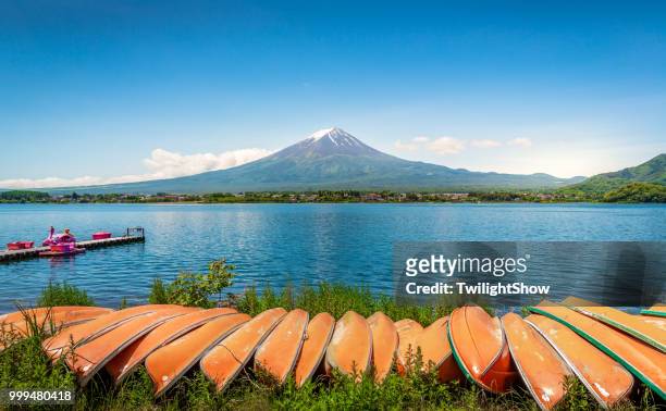 mt. fuji japan volcano mountain at summer day with blue sky with boat - fujikawaguchiko stock pictures, royalty-free photos & images