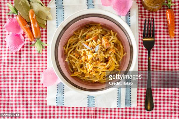 tasty pasta italian tomato sauce pasta on the table - tomato pasta stock pictures, royalty-free photos & images