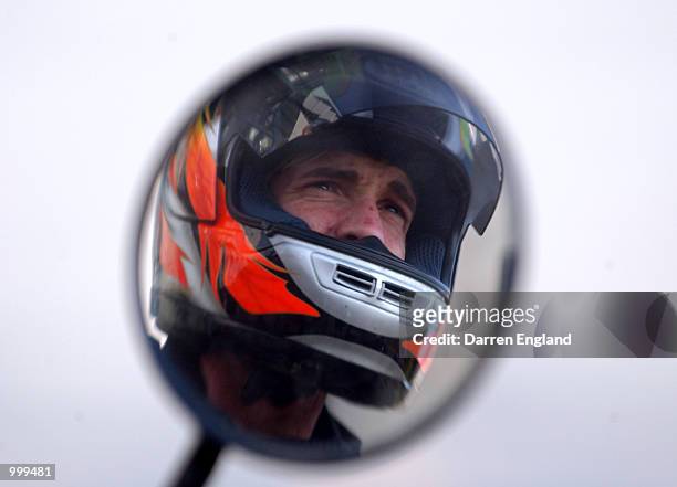 Jason Akermanis of the Brisbane Lions leaves training on his motorbike the day after winning the AFL Brownlow Medal at the Gabba in Brisbane,...