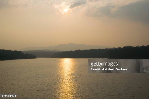 sunset at chikhlihole dam, coorg, india - coorg stock pictures, royalty-free photos & images