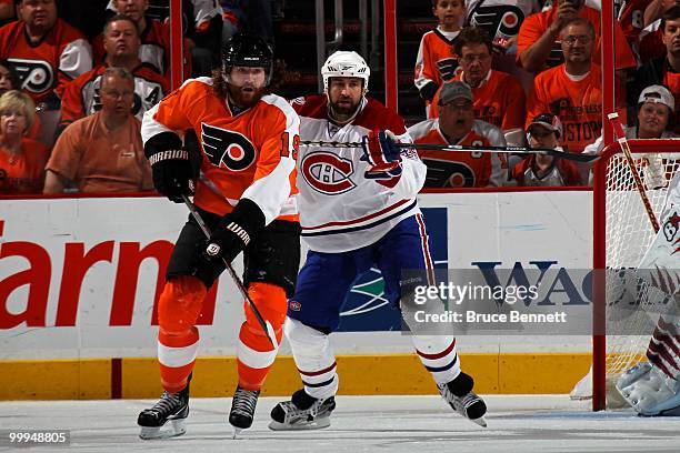 Roman Hamrlik of the Montreal Canadiens defends against Scott Hartnell of the Philadelphia Flyers in Game 1 of the Eastern Conference Finals during...