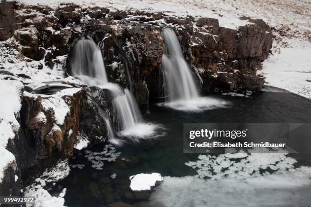 waterfall at mt kirkjufell, near grundarfjoerdur, western region, iceland - west central iceland stock pictures, royalty-free photos & images