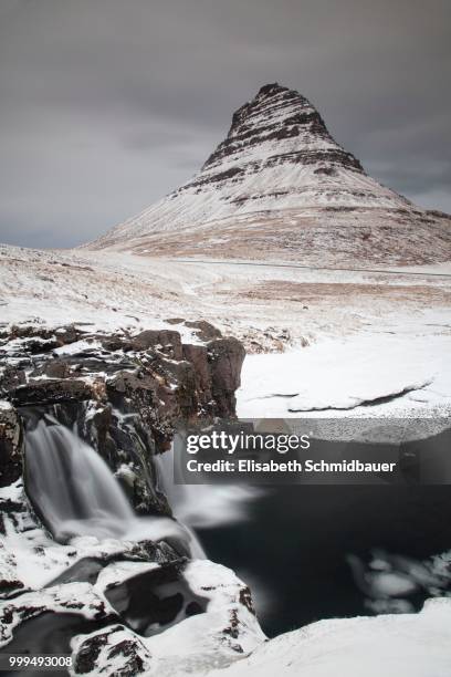 mt kirkjufell with a waterfall, near grundarfjoerdur, western region, iceland - west central iceland stock pictures, royalty-free photos & images