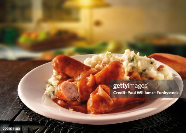 british food, sausage, onion gravy and mashed potatoes - mashed stock pictures, royalty-free photos & images