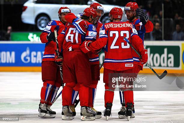 Maxim Afinogenov of Russia celebrates with team mates after scoring the fifth goal during the IIHF World Championship qualification round match...