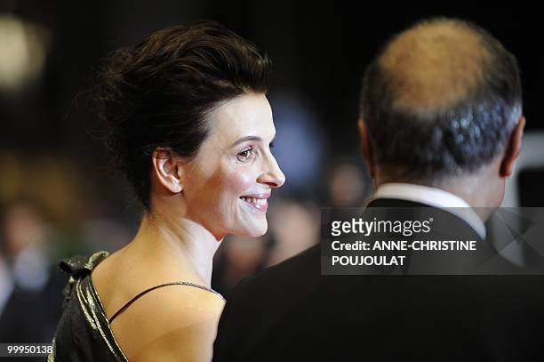 French actress Juliette Binoche and Iranian director Abbas Kiarostami arrive for the screening of "Copie Conforme presented in competition at the...