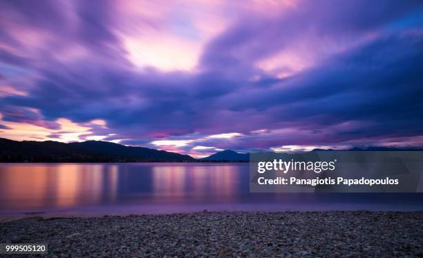 cloudy sunset - papadopoulos stockfoto's en -beelden