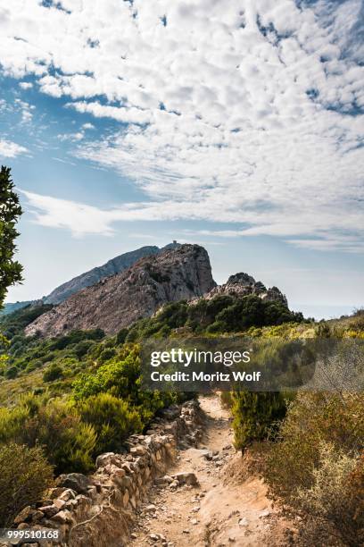 hiking trail, genoese tower on a cliff, coast and mountains, gulf of porto, corsica, france - genoese stock pictures, royalty-free photos & images