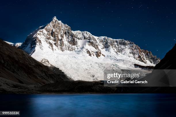 mountain glaciers and a lake, at night, perito moreno national park, patagonia, argentina - lake argentina stock pictures, royalty-free photos & images