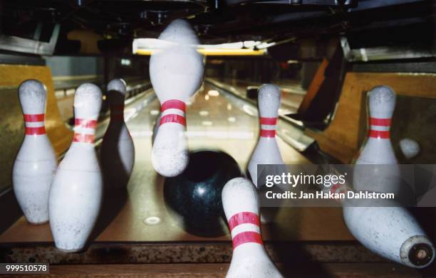 bowling ball striking pins - bowling alley pins stock pictures, royalty-free photos & images