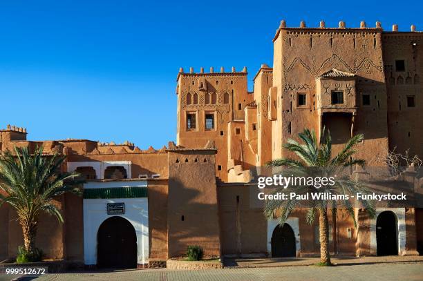 exterior of the mud brick taourirt kasbah built by pasha glaoui, unesco world heritage site, ouarzazate, morocco - entrance gate stock pictures, royalty-free photos & images