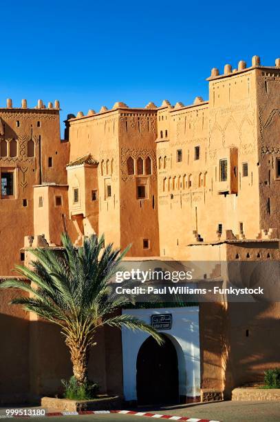 exterior of the mud brick taourirt kasbah built by pasha glaoui, unesco world heritage site, ouarzazate, morocco - entrance gate stock pictures, royalty-free photos & images
