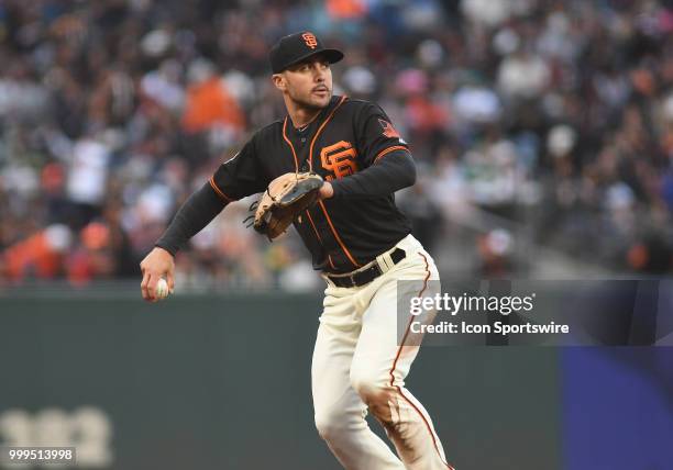 San Francisco Giants infielder Chase d'Arnaud throws the ball to first base in an MLB game between the San Francisco Giants and Oakland Athletics at...