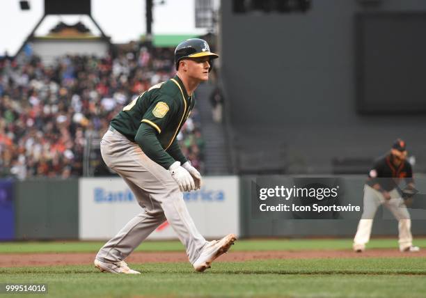 Oakland Athletics third baseman Matt Chapman leads off third base in an MLB game between the San Francisco Giants and Oakland Athletics at AT&T Park...