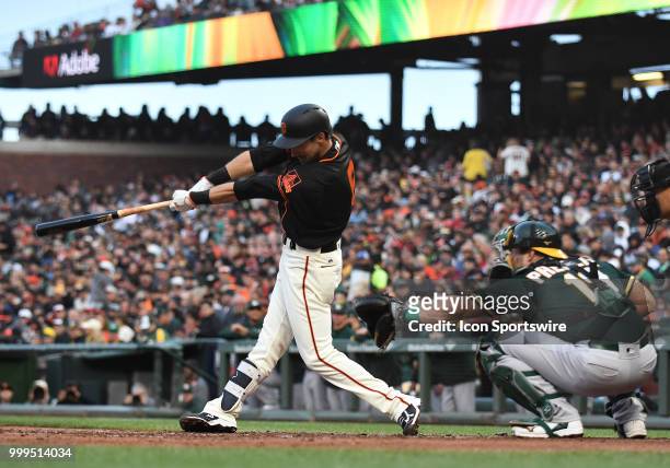 San Francisco Giants outfielder Steven Duggar hits a double in an MLB game between the San Francisco Giants and Oakland Athletics at AT&T Park in San...