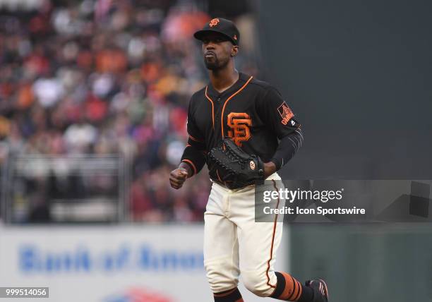 San Francisco Giants outfielder Andrew McCutchen runs off the field in an MLB game between the San Francisco Giants and Oakland Athletics at AT&T...