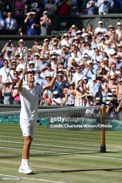 Mens Singles Final - Novak Djokovic v Kevin Anderson - Novak Djokovic celebrates winning the Grand Slam at All England Lawn Tennis and Croquet Club...