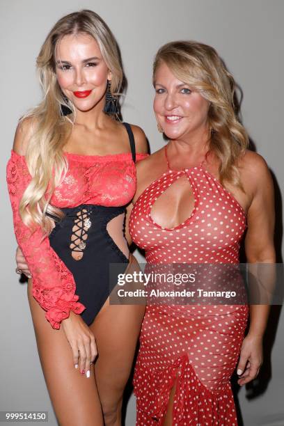 Agueda Lopez and Designer Lourdes "Luli" Hanamian pose backstage for Luli Fama during the Paraiso Fashion Fair at The Paraiso Tent on July 14, 2018...