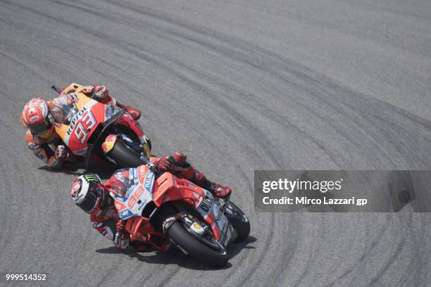 Jorge Lorenzo of Spain and Ducati Team leads Marc Marquez of Spain and Repsol Honda Team during the MotoGP race during the MotoGp of Germany - Race...