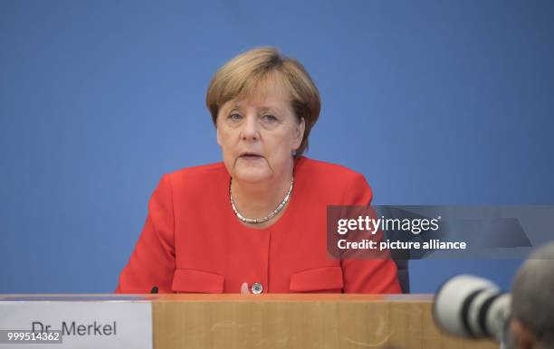 German Chancellor Angela Merkel speaks on current topics of interior and exterior policies at the summer press conference at the federal press...