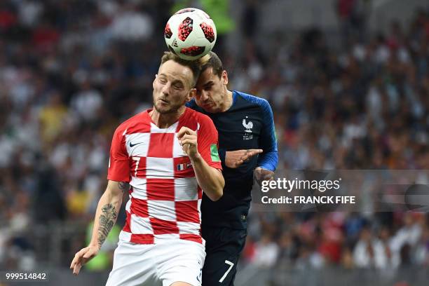 Croatia's midfielder Ivan Rakitic vies with France's forward Antoine Griezmann during the Russia 2018 World Cup final football match between France...