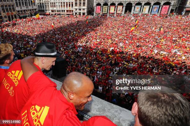 Belgium's players Dries Mertens, Thomas Meunier, Vincent Kompany and Jan Vertonghen celebrate at the balcony in front of more than 8000 supporters at...
