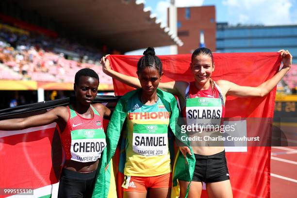 Miriam Cherop of Kenya, Alemaz Samuel of Ethiopia and Delia Sclabas of Switzerland celebrate celebrate winning medals in the final of the women's...