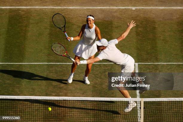 Jamie Murray of Great Britain and Victoria Azarenka of Belarus return against Alexander Peya of Austria and Nicole Melichar of The United States...