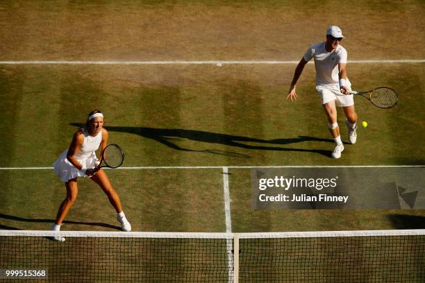 Jamie Murray of Great Britain and Victoria Azarenka of Belarus return against Alexander Peya of Austria and Nicole Melichar of The United States...