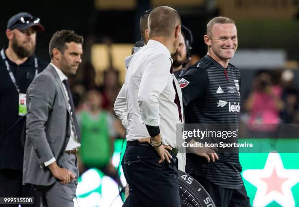 United forward Wayne Rooney prepares to come into the game as a second half sub during a MLS match between D.C. United and the Vancouver Whitecaps on...