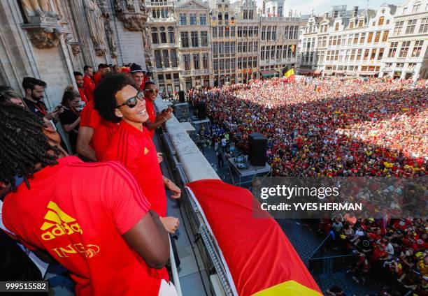 Belgium's Dedryck Boyata and Belgium's Axel Witsel celebrate at the balcony in front of more than 8000 supporters at the Grand-Place, Grote Markt in...
