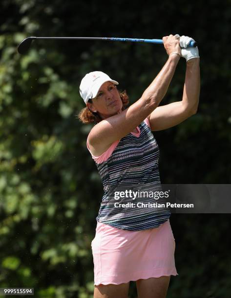 Juli Inkster plays a tee shot on the eighth hole during the final round of the U.S. Senior Women's Open at Chicago Golf Club on July 15, 2018 in...