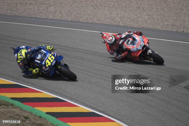 Jorge Lorenzo of Spain and Ducati Team leads Valentino Rossi of Italy and Movistar Yamaha MotoGP during the MotoGP race during the MotoGp of Germany...