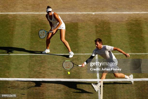 Alexander Peya of Austria and Nicole Melichar of The United States return against Jamie Murray of Great Britain and Victoria Azarenka of Belarus...