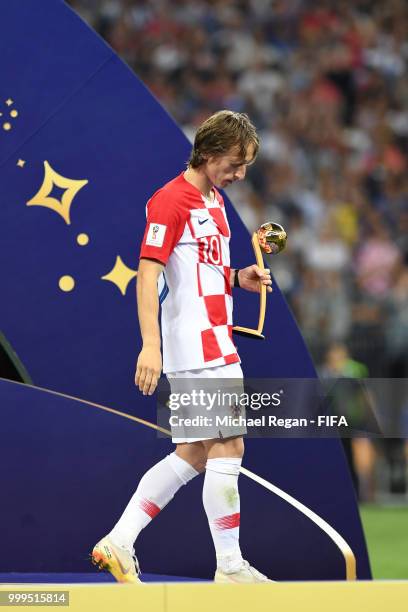 Luka Modric of Croatia receives the adidas Golden Ball award following the 2018 FIFA World Cup Final between France and Croatia at Luzhniki Stadium...