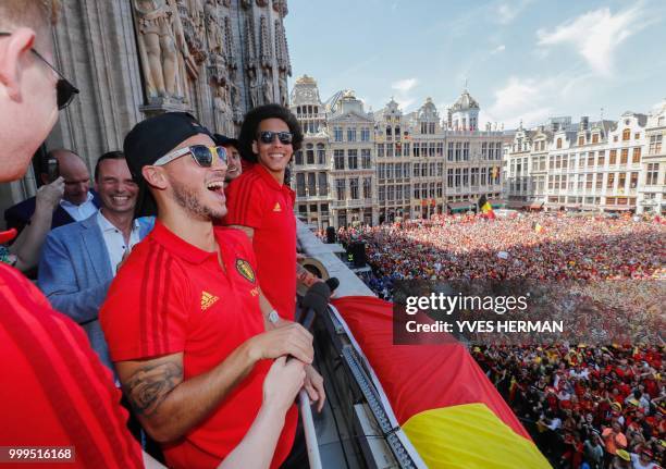 Belgium's players Kevin De Bruyne , Eden Hazard and Axel Witsel celebrate at the balcony in front of more than 8000 supporters at the Grand-Place,...