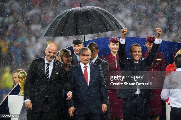 President Gianni Infantino, President of Russia Vladimir Putin and French President Emmanuel Macron are seen following the 2018 FIFA World Cup Final...