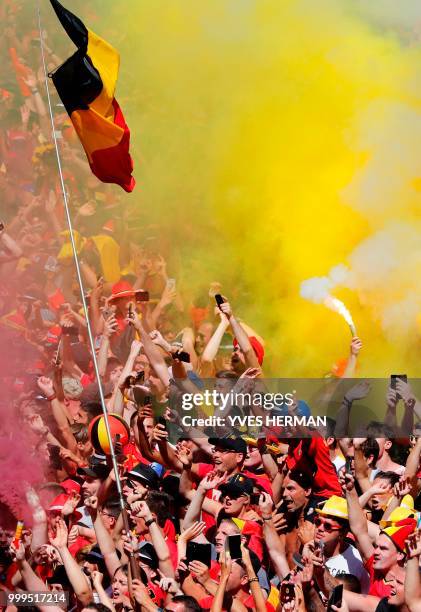 Belgian supporters celabrate at the Grand Place/Grote Markt in Brussels city center, as Belgian national football team Red Devils arrive to celebrate...