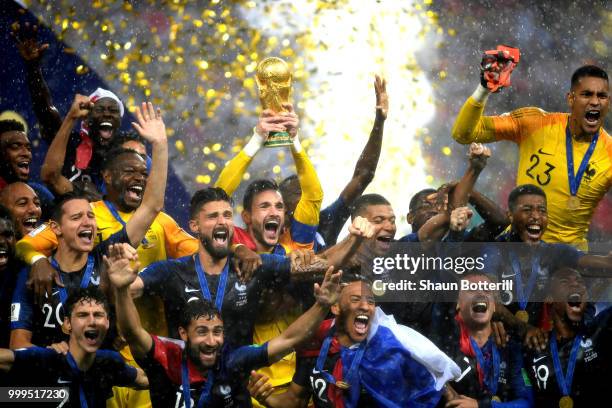 Hugo Lloris of France lifts the World Cup trophy to celebrate with his teammates after the 2018 FIFA World Cup Final between France and Croatia at...