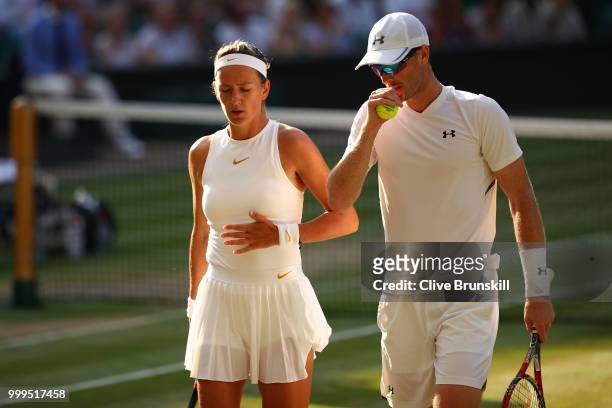 Jamie Murray of Great Britain and Victoria Azarenka of Belarus discuss tactics during the Mixed Doubles final against Alexander Peya of Austria and...